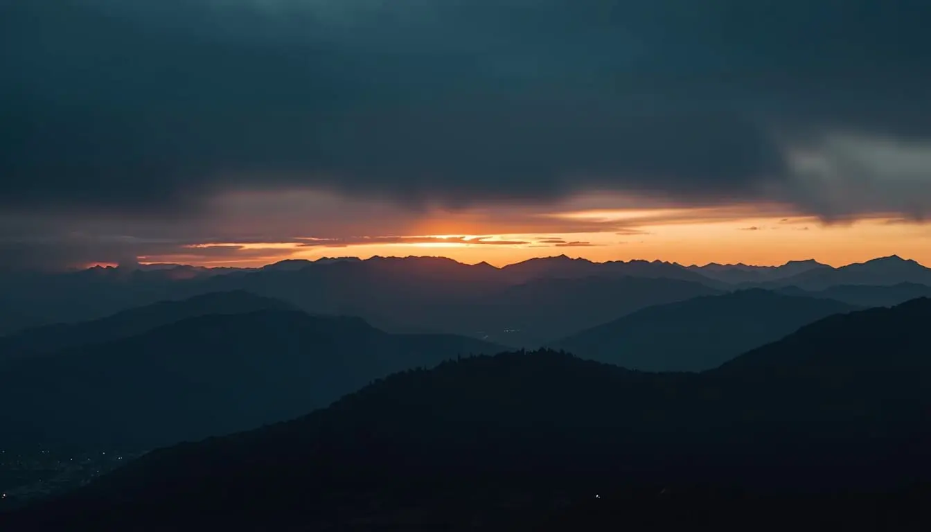 First light of dawn hitting a distant mountain range